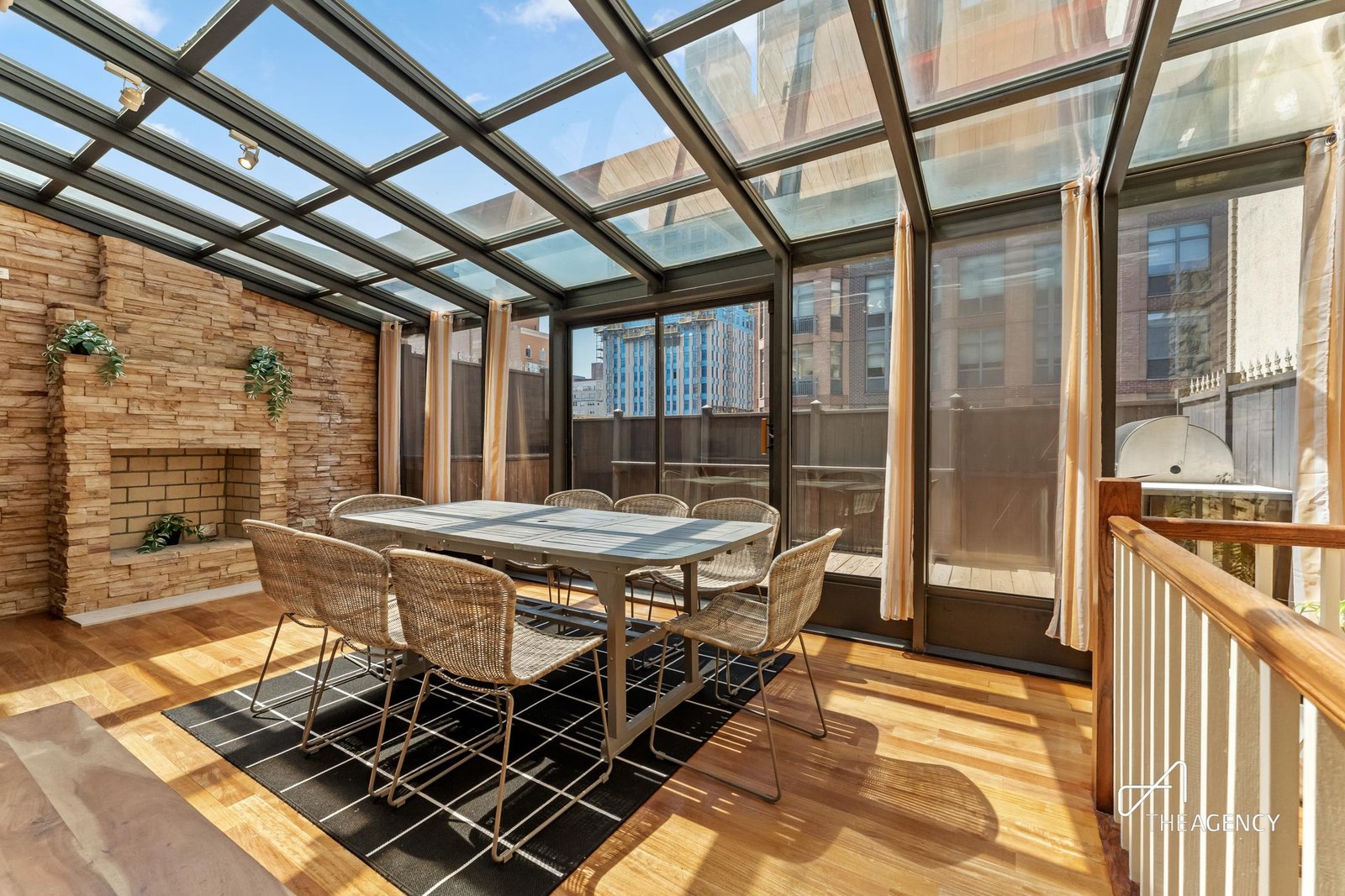 Glass-enclosed room with a dining table at 197 E 76th Street