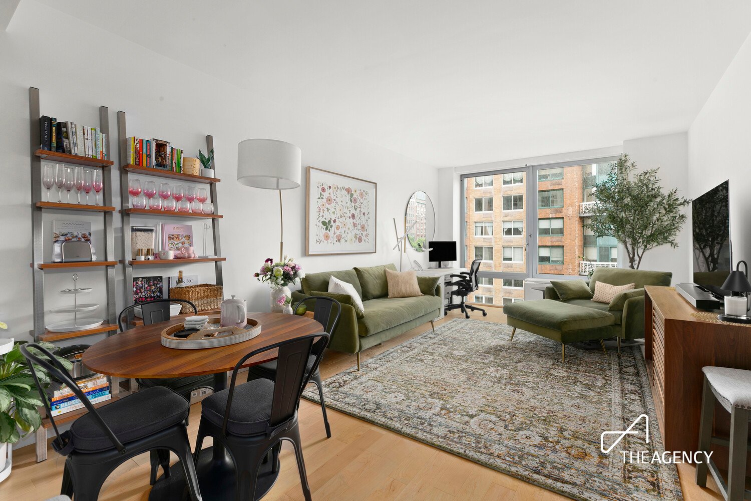 Living and dining room with open shelving at 212 W 72nd Street 5G