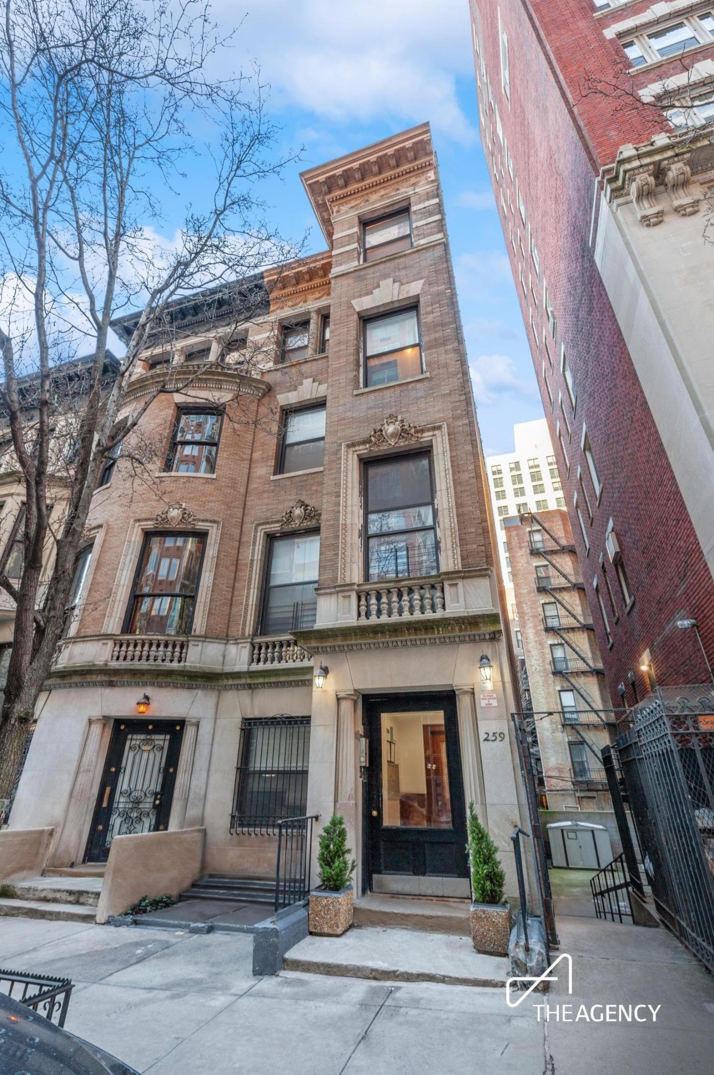 Exterior of a brick townhouse with a front stoop at 259 W 90th Street 3-F