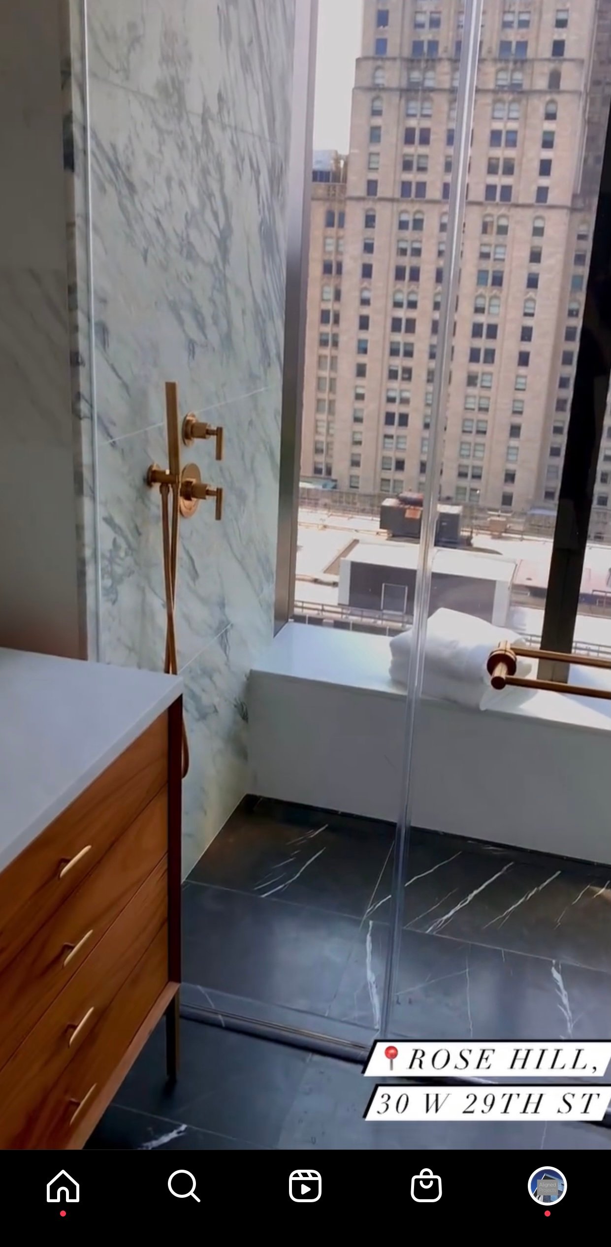 Instagram reel of a marble bathroom with a city view, labelled Rose Hill, 30 W 29th St