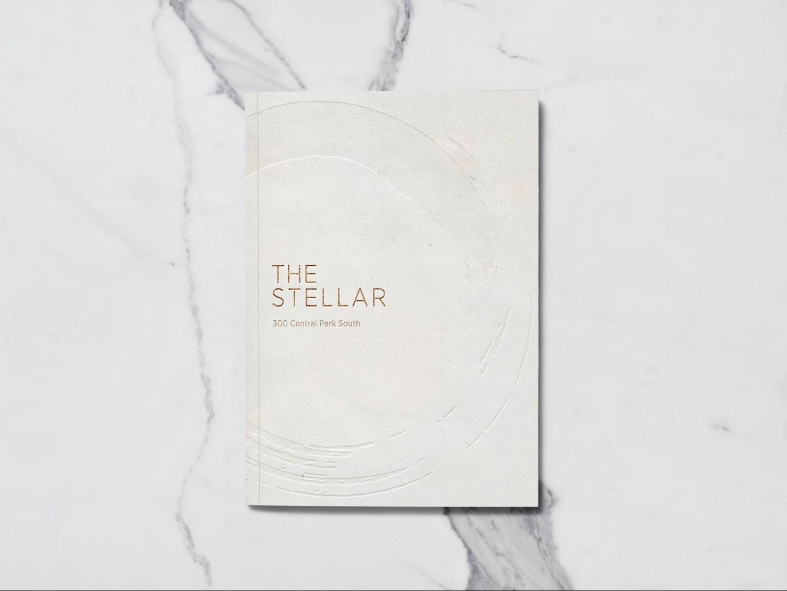 Brochure cover reading “The Stellar” on a marble surface